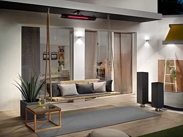 Heatscope Pure 3000W Radiant Heater ceiling-mounts above a cushioned private terrace, delivering silent infrared patio warmth.